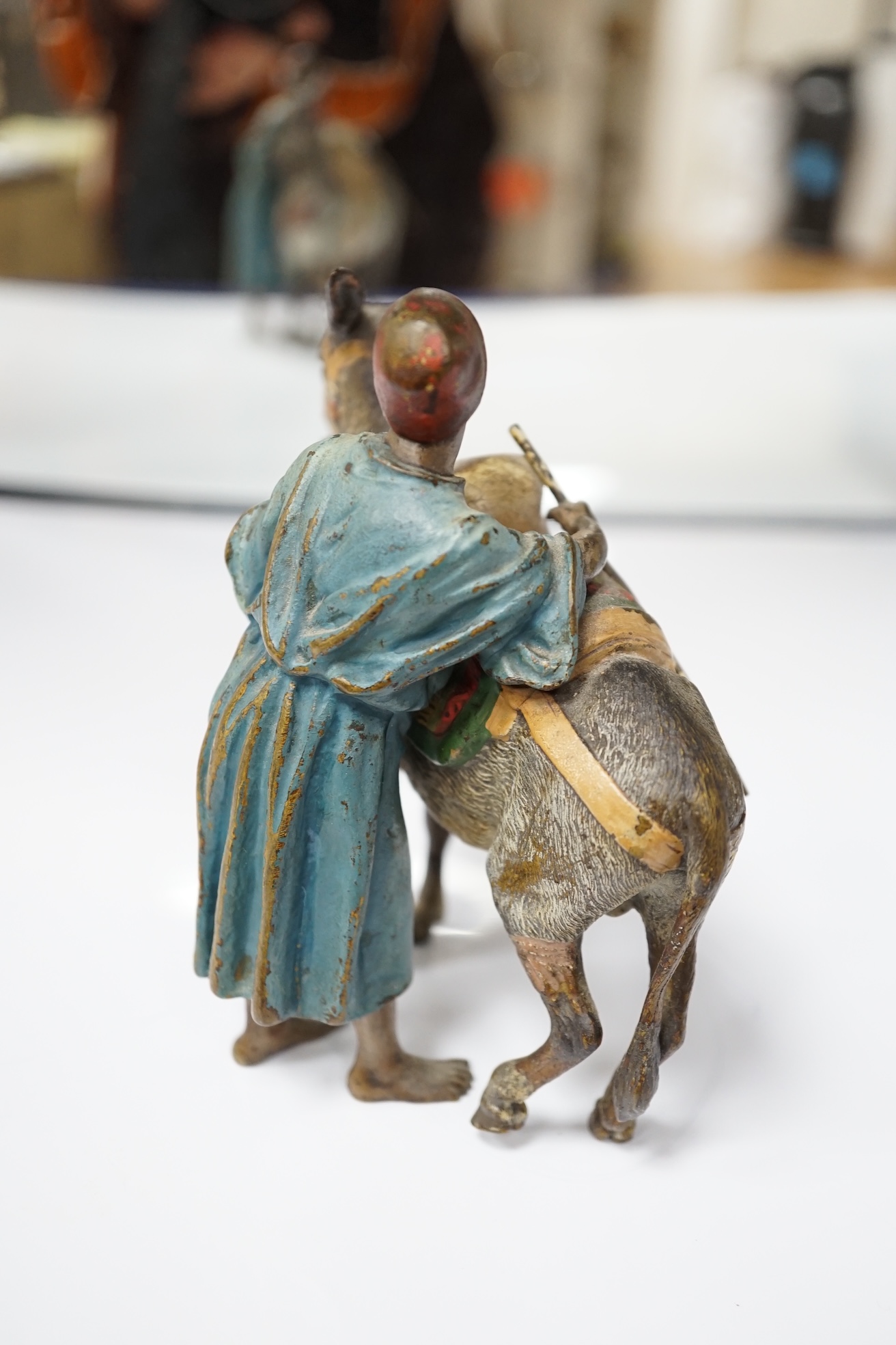 A Viennese cold painted bronze of an Arab trader with mule, 14cm high, 13cm wide. Condition - slight chipping to painted areas